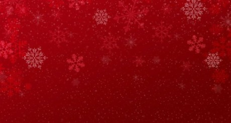 a red holiday banner with white snowflakes 