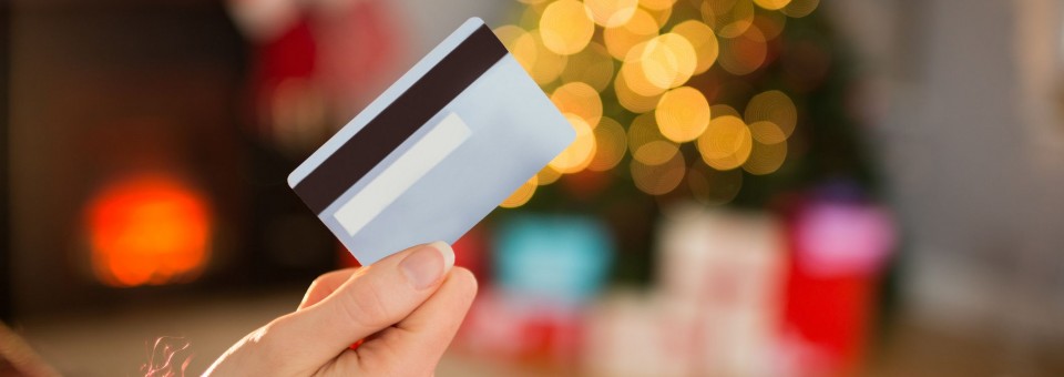 Woman Holding Credit Card during Holidays